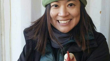 Esther Liu holds a chicken