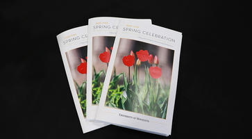 Programs of the ICGC Spring Dinner for 2022, which depict the text "2022 ICGC Spring Celebration" with tulip flowers on the front.